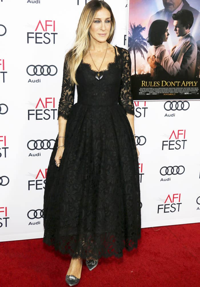 Sarah Jessica Parker radiated elegance in a black lace tea-length dress featuring three-quarter sleeves