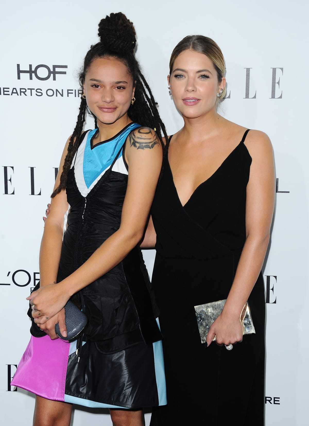 Her top knot hairstyle made Sasha Lane appear slightly taller than Ashley Benson at the 2016 Elle Women In Hollywood Awards
