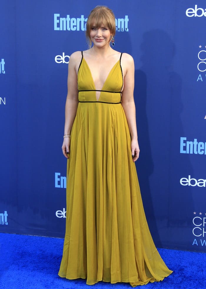 Bryce Dallas Howard stuns in a mustard yellow Topshop gown with a plunging neckline at the Critics' Choice Awards
