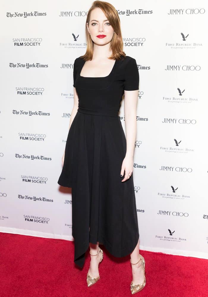 Emma Stone stuns in a classic black fit-and-flare dress by Preen, paired with gold-embellished Jimmy Choo heels at the San Francisco Film Society's "La La Land" presentation