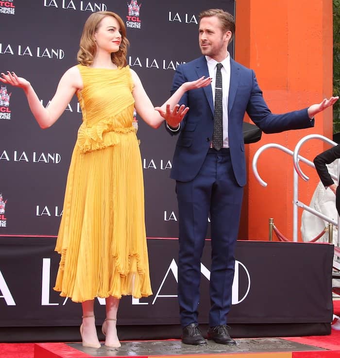 Emma Stone and Ryan Gosling cement their hand and footprints at the TCL Chinese Theater in Hollywood on December 6, 2016