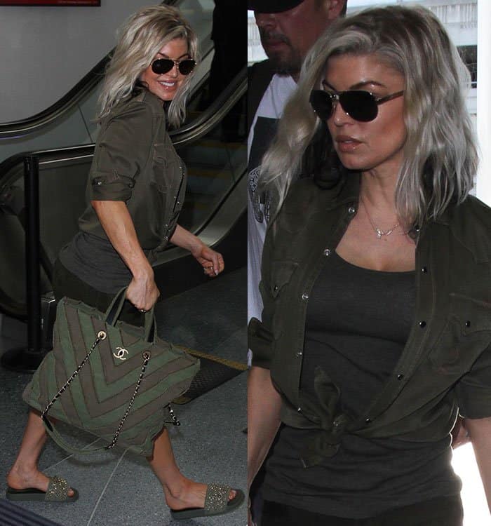 Fergie sporting a Saint Laurent Western shirt, Chanel khaki green gold chain slide sandals, and a chic Chanel khaki canvas patchwork chevron shopping bag