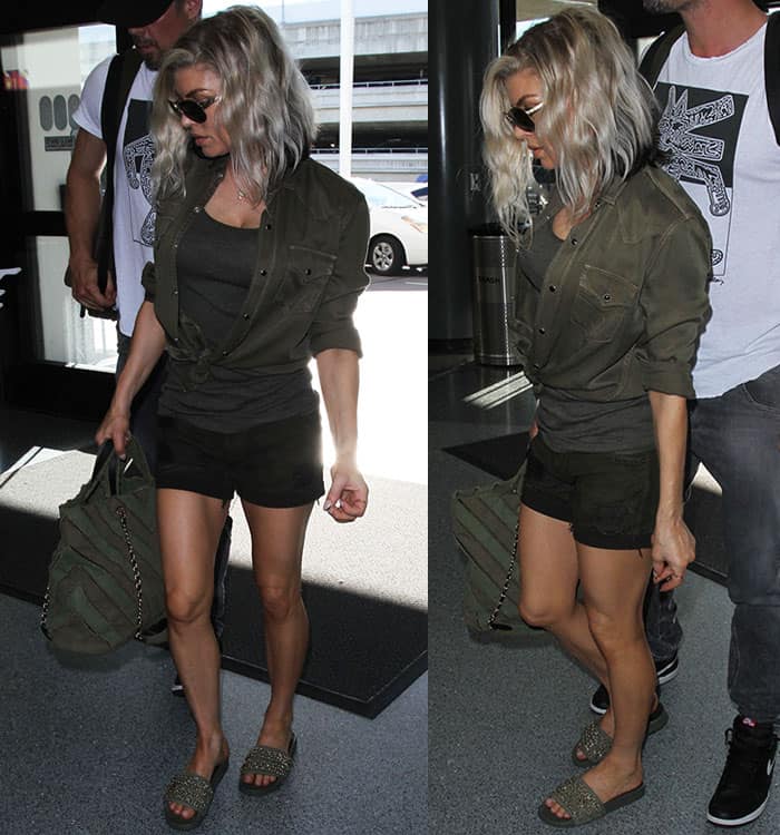 Fergie goes for an edgy, monochromatic look in shades of olive green, pairing her military-inspired shirt and shorts with matching accessories