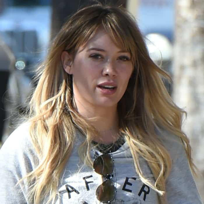 Hilary Duff rocks a natural look with minimal makeup, letting her tousled blonde waves take center stage