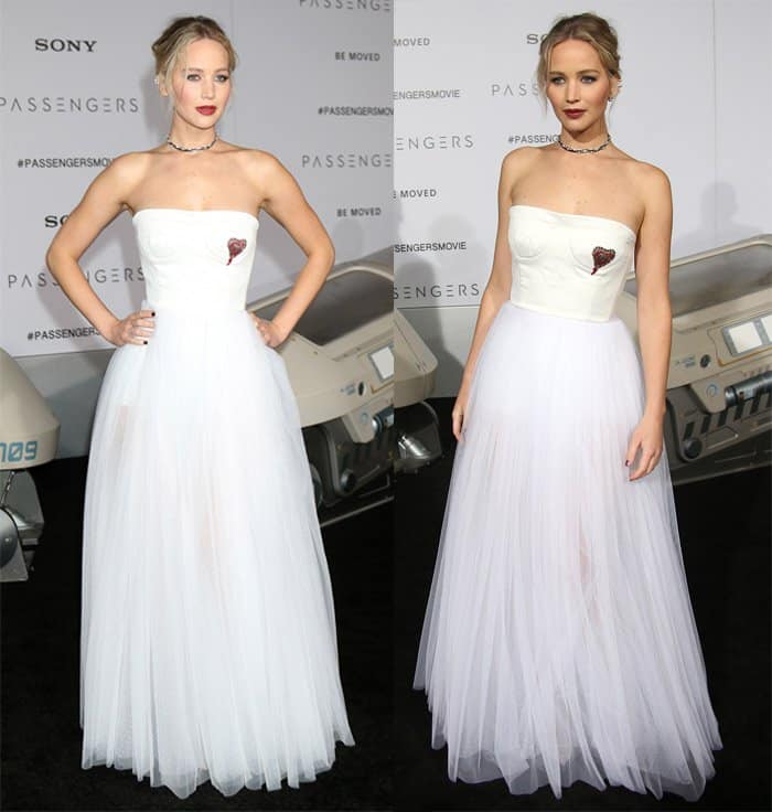 Jennifer Lawrence wearing a bridal-inspired white Dior gown with a floor-length tulle skirt and a corset bodice featuring a small red embroidered heart