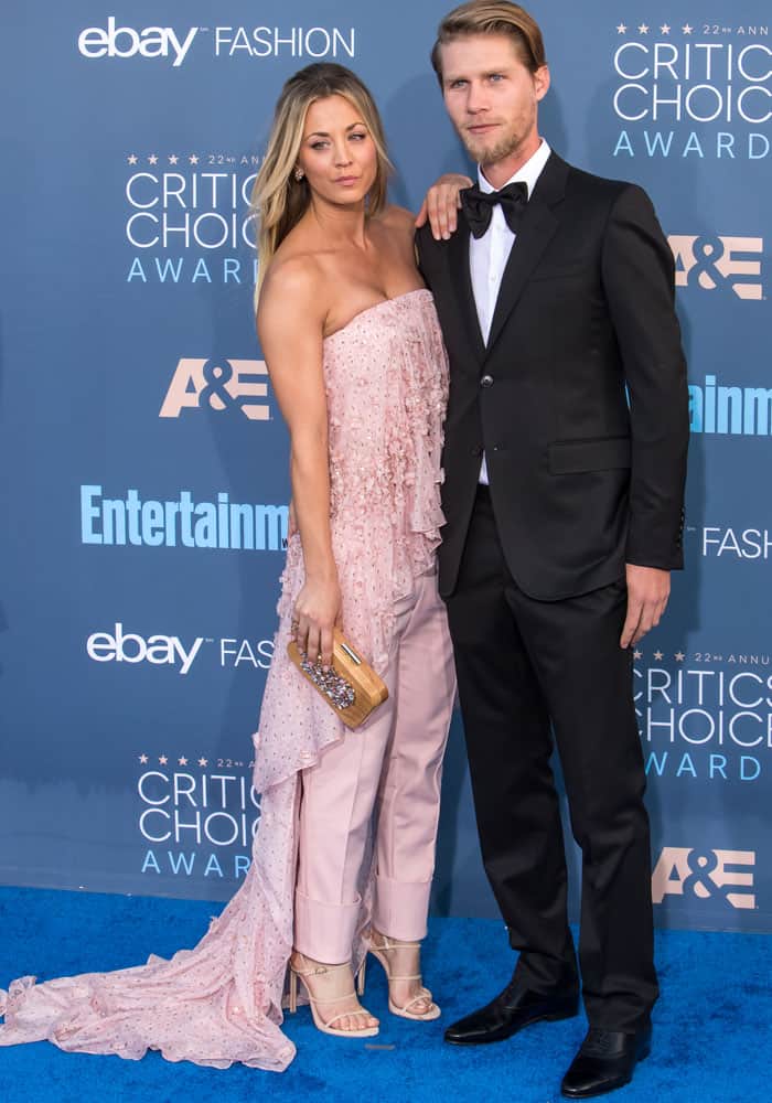 Kaley Cuoco and Karl Cook make a stylish couple on the blue carpet at the 2016 Critics' Choice Awards, with Kaley in a pink ruffled Noon by Noor ensemble and Karl in a classic black tuxedo