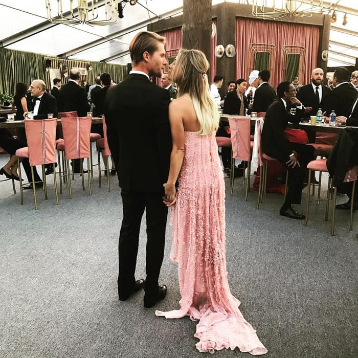 Kaley Cuoco and Karl Cook share a quiet moment at the 2016 Critics' Choice Awards