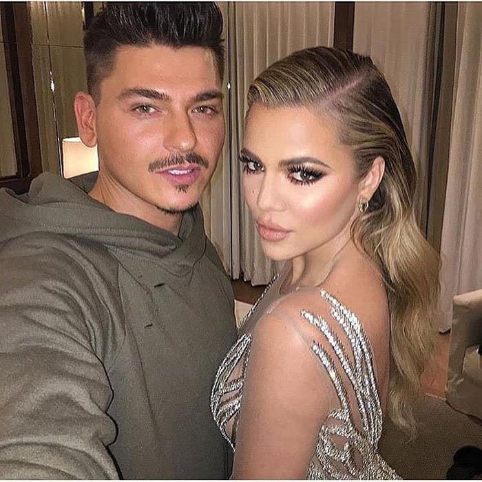 Khloé Kardashian poses with her makeup artist, Mario Dedivanovic, showcasing her flawless glam and stunning sheer gown with intricate embellishments