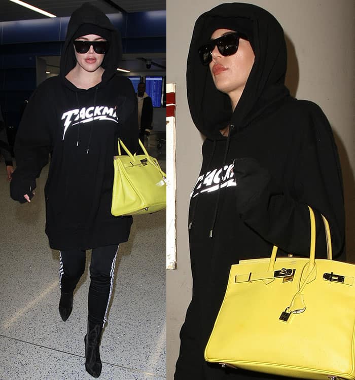 Khloe Kardashian totes a yellow lime bag from the Hermès Candy Collection at Los Angeles International Airport (LAX)