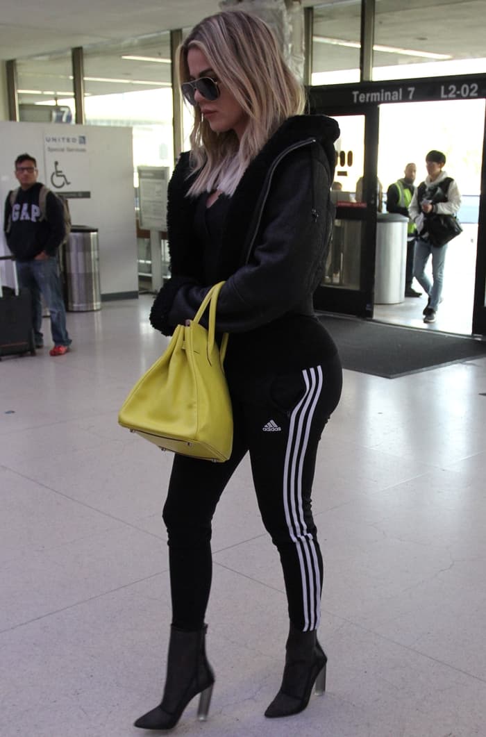 Khloé Kardashian wearing Adidas Originals 'Supergirl' track pants