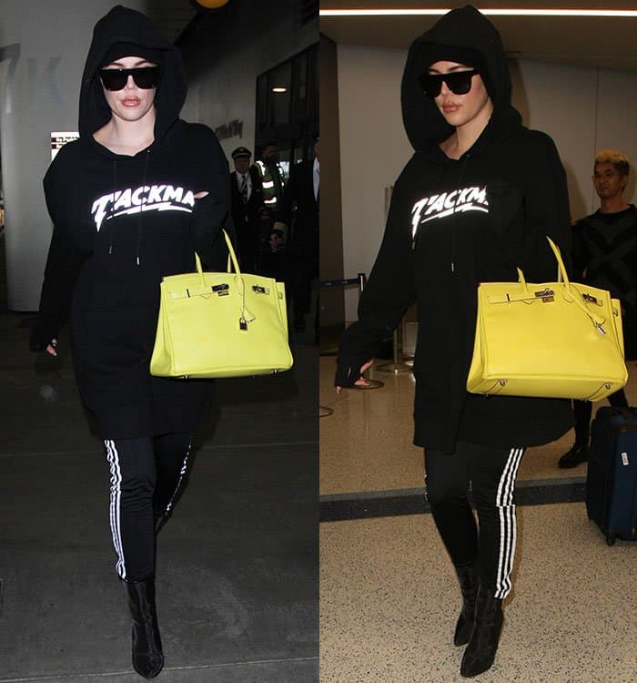 Khloe Kardashian styled her Adidas track pants with a hoodie and Yeezy mesh ankle boots
