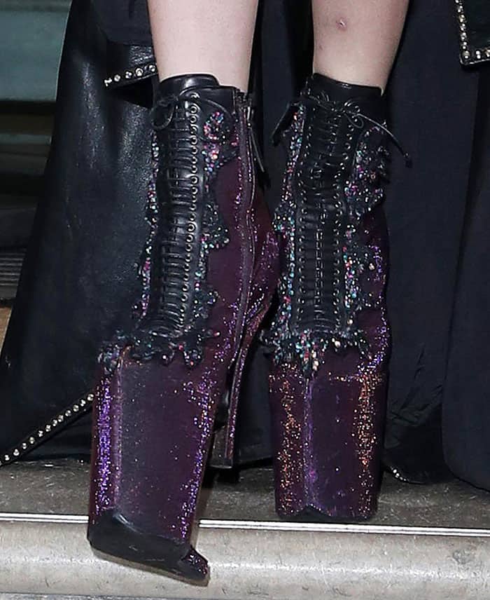Lady Gaga wears a pair of bizarre boots that feature lace-up fastenings, tall platforms and five-inch heels