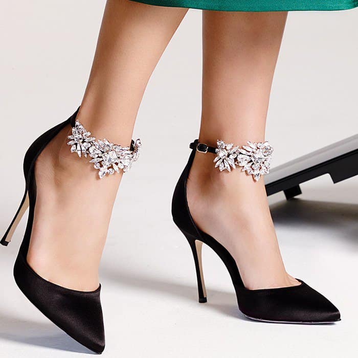 Eye-catching sparkling crystals embellish the slim ankle strap of a stunning pointy-toe pump lifted by a svelte stiletto heel