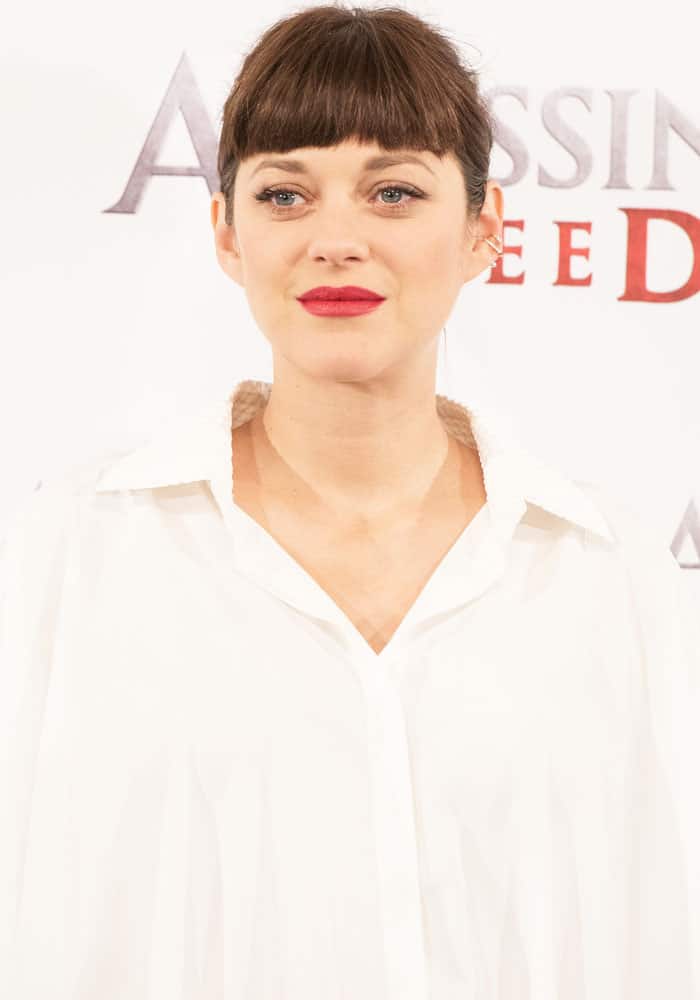 Marion Cotillard stuns in a minimalistic, billowy white shirt at the 'Assassin's Creed' photocall in Madrid