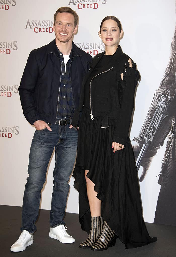 Marion Cotillard and Michael Fassbender at the photocall for "Assassin's Creed" held at Cafe Moskau in Berlin