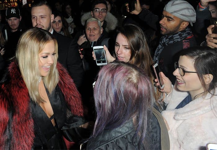 Rita chats with fans before heading into the event