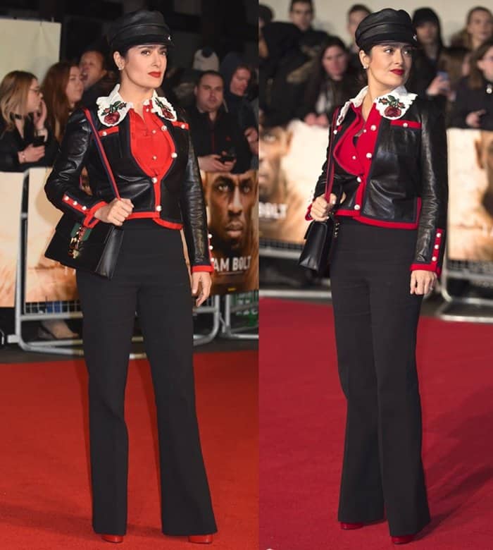 Salma Hayek embraced military chic in flared black trousers paired with bold red heels and Gucci pieces—a floral-collared shirt, a structured leather jacket with grosgrain trim, and the 'Sylvie' shoulder bag