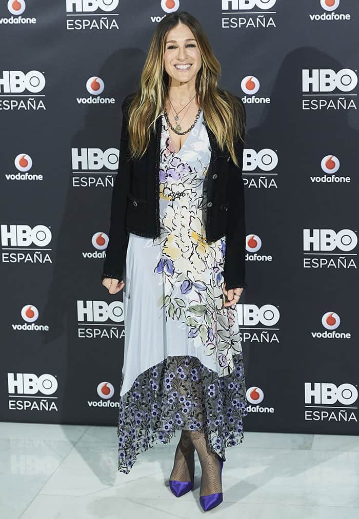 Sarah Jessica Parker dazzles at the HBO Spain photo call in a Tracy Reese floral dress paired with her signature SJP "Rampling" purple satin pumps, exuding timeless elegance