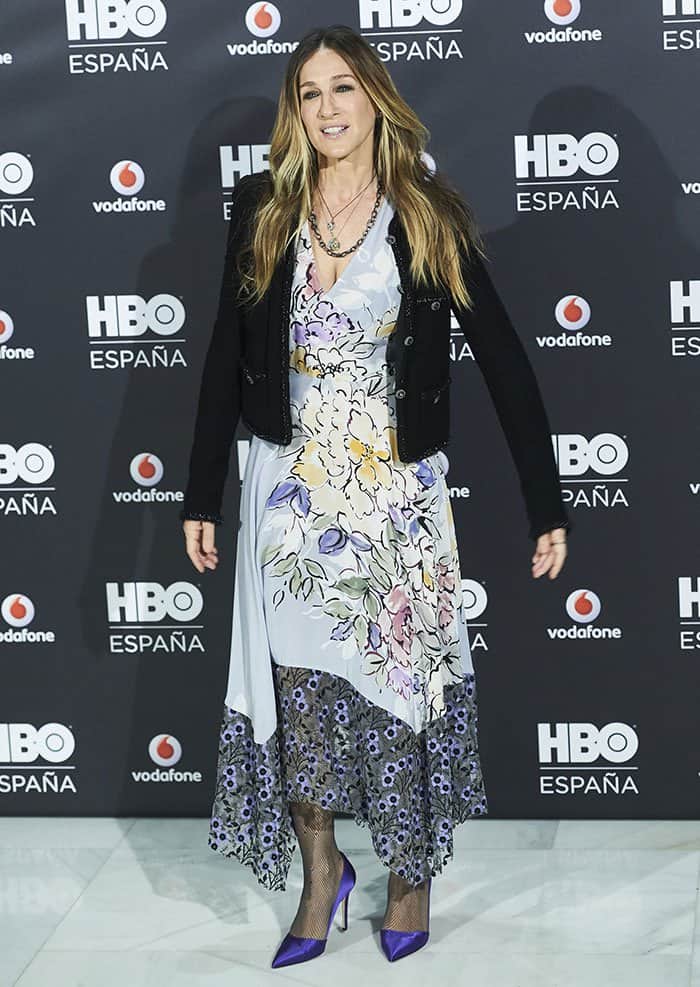 Sarah Jessica Parker’s dress is a stunning floral Tracy Reese number from the Spring 2017 collection, featuring a low-cut v-neckline, an asymmetrical hem, and a mix of semi-sheer and printed fabrics for a romantic, flowing silhouette