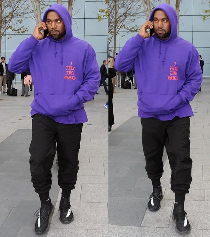 Kanye West trägt Yeezy Boost Sneakers am Flughafen Heathrow in London am 10. April 2016