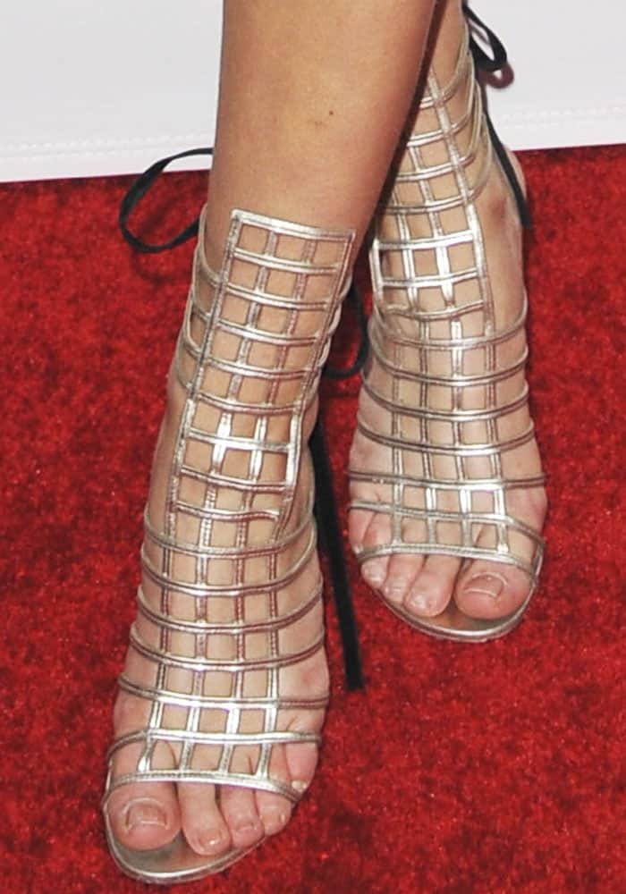 Zara Larsson's sexy feet in silver cage sandals by Saint Laurent
