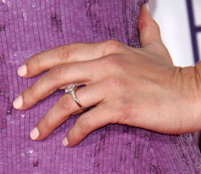 Ashley Greene's engagement ring boasts an exquisite design featuring an oval-cut center stone that radiates beauty