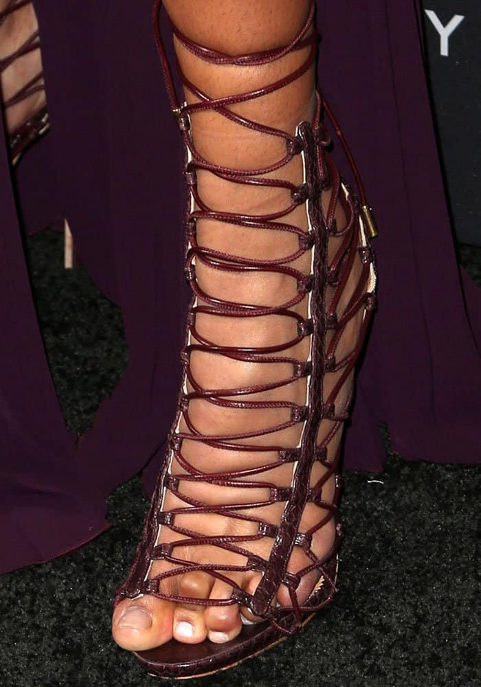 Chanel Iman's crunchy dry toes with chipped nail polish look like they're behind bar