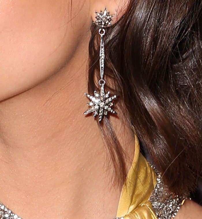 Emily Ratajkowski adds a celestial touch to her look with crystal-studded star earrings from H. Stern