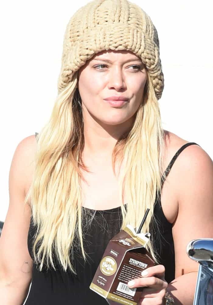 Hilary Duff steps out in Los Angeles, looking cozy in a chunky knit beanie while sipping on Stumptown coffee