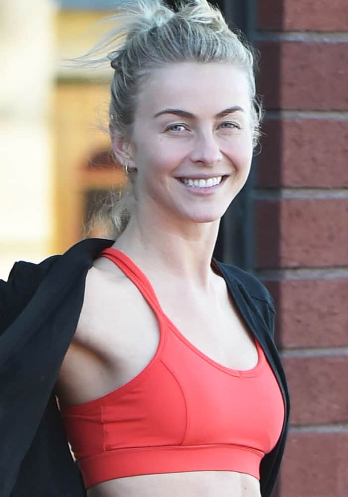 Julianne Hough in an orange sports bra leaves a fitness class