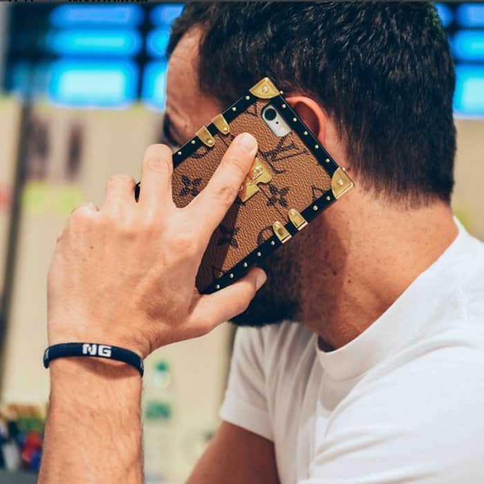 Nicolas Ghesquière shares a close-up of the Louis Vuitton Petite Malle iPhone case, a luxe mini-trunk-inspired accessory featuring the brand’s signature monogram canvas, gold hardware, and reinforced corners