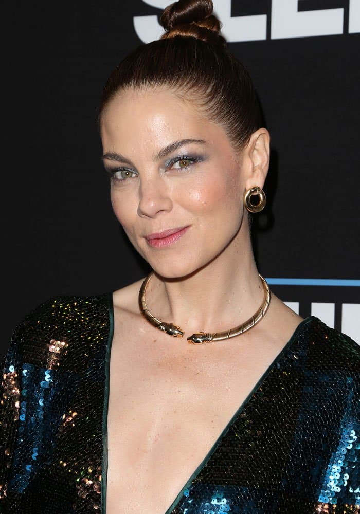 Michelle Monaghan with rounded earrings, a choker, and a tightly wound topknot at the premiere of Open Road Films' "Sleepless"