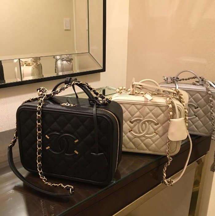 A stunning collection of Chanel vanity case bags in classic black, ivory, and silver, featuring the brand’s signature quilted leather, interwoven chain straps, and iconic CC logo—luxury at its finest