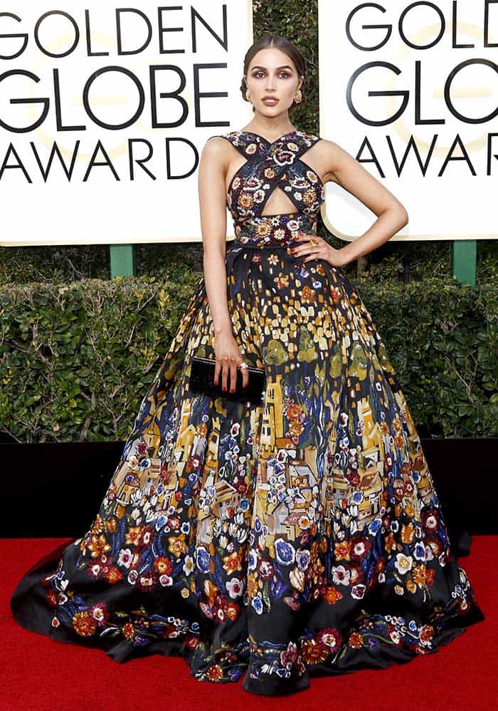 Olivia Culpo makes a statement in an ornate Zuhair Murad ball gown with vintage-inspired cross-strapped details