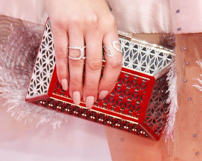 The young actress stepped up her bling game with a silver clutch from Yliana Yepez