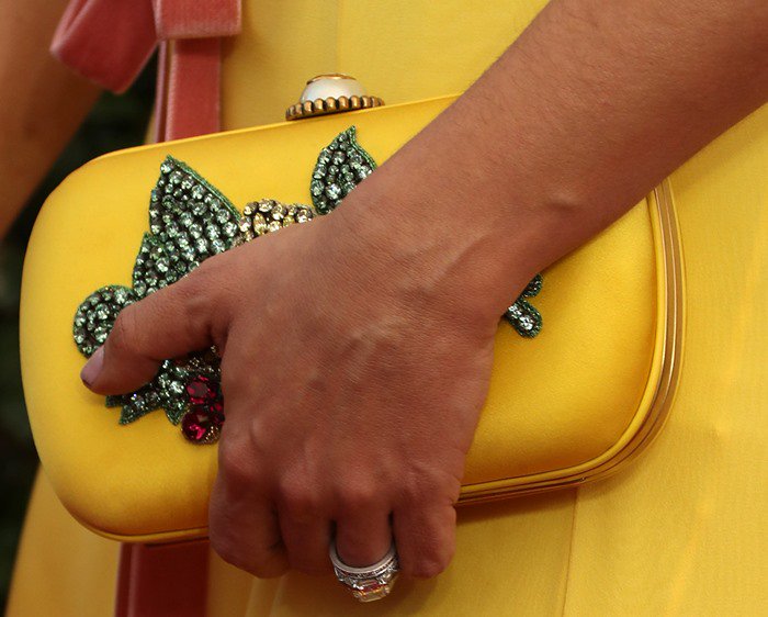 Salma Hayek's look was elevated by a stunning yellow Gucci clutch embellished with crystals
