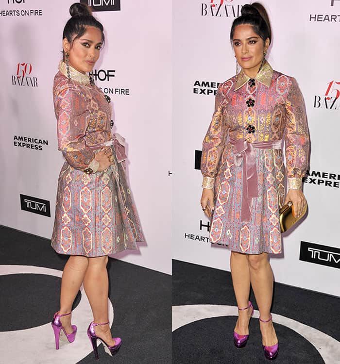Salma Hayek showcases the intricate details of her Gucci jacquard dress from both angles, featuring a stunning Indian-inspired pattern, jeweled floral buttons, a satin waist tie, and elegant long sleeves