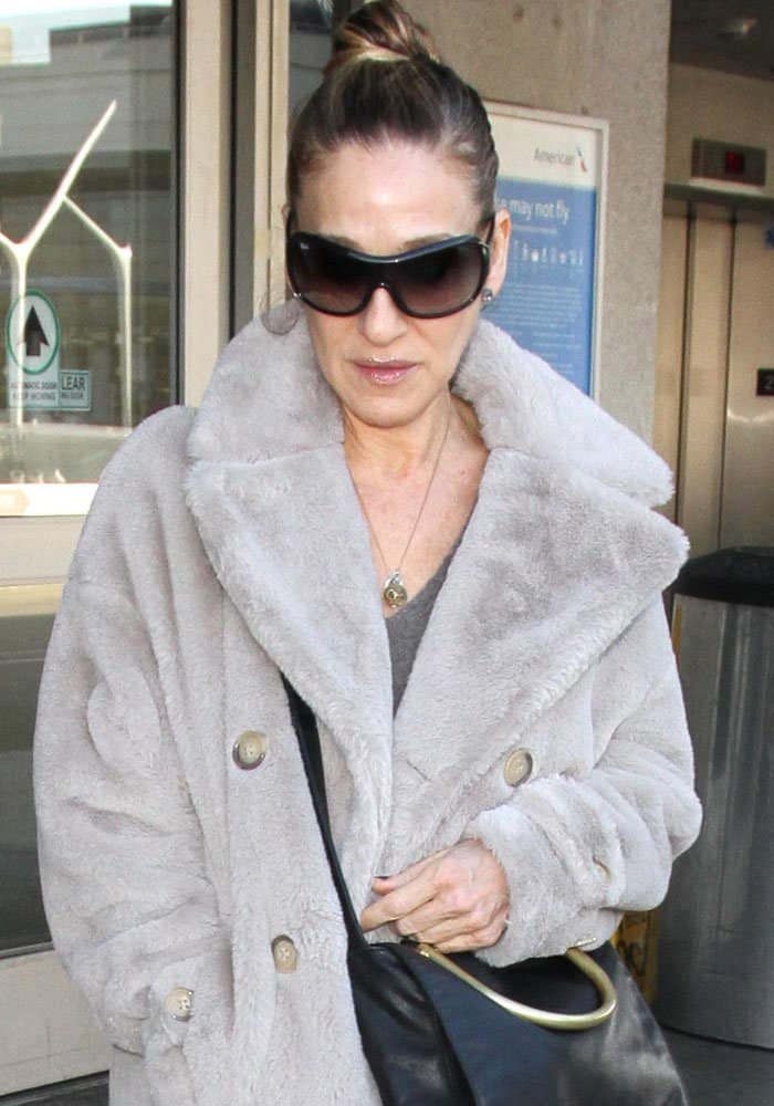 Sarah Jessica Parker keeps it cozy in an oversized faux fur coat while arriving at Los Angeles Airport (LAX) on January 17, 2017