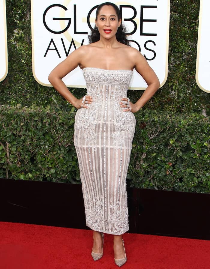 Tracee Ellis Ross's exquisite strapless, sheer embellished dress, cut at ankle length and featuring a back split, perfectly accentuated her curves