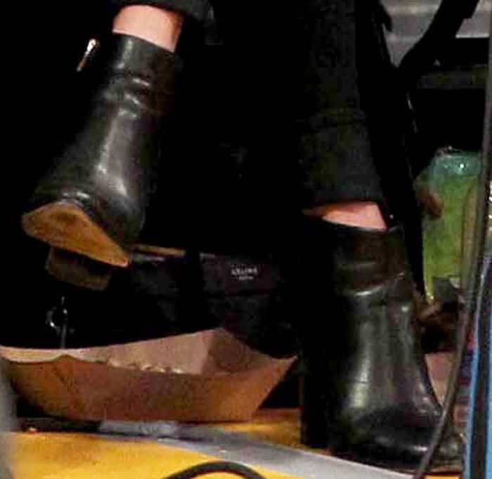 Vanessa pairs her favorite Alexander Wang 'Gabi' boots with sleek black jeans, demonstrating how to style versatile ankle boots for casual chic looks