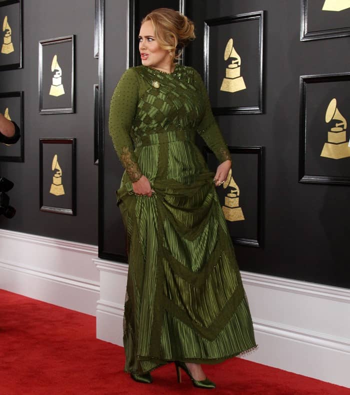 Adele paired her olive green dress with matching high heel pumps