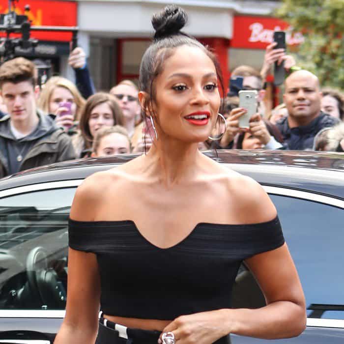 Alesha Dixon shows off her flat abs in a black Bardot top