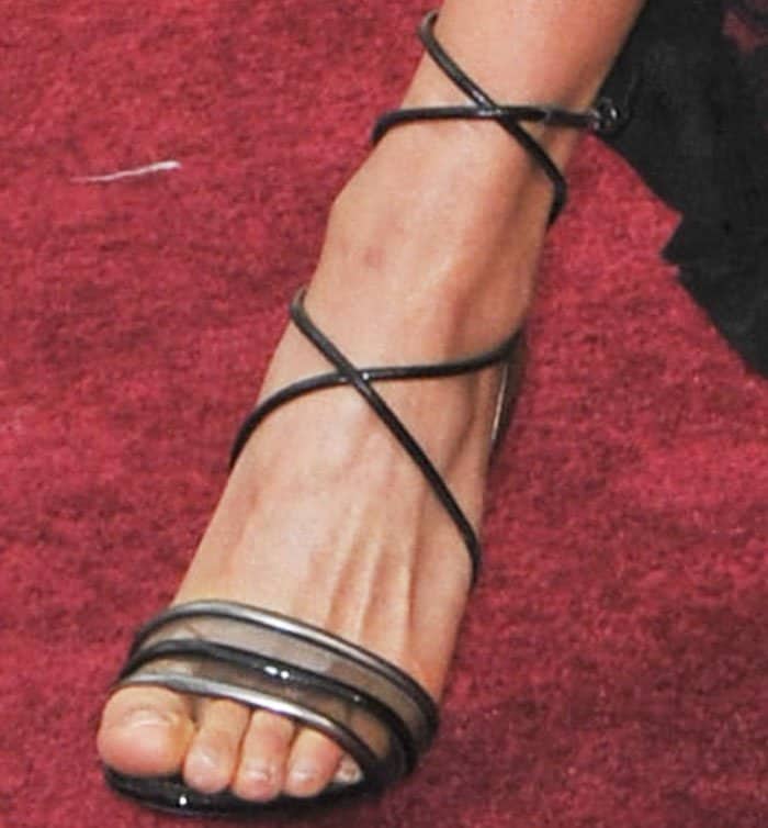 Alicia wears a chunky-heeled lace-up sandal by Louis Vuitton