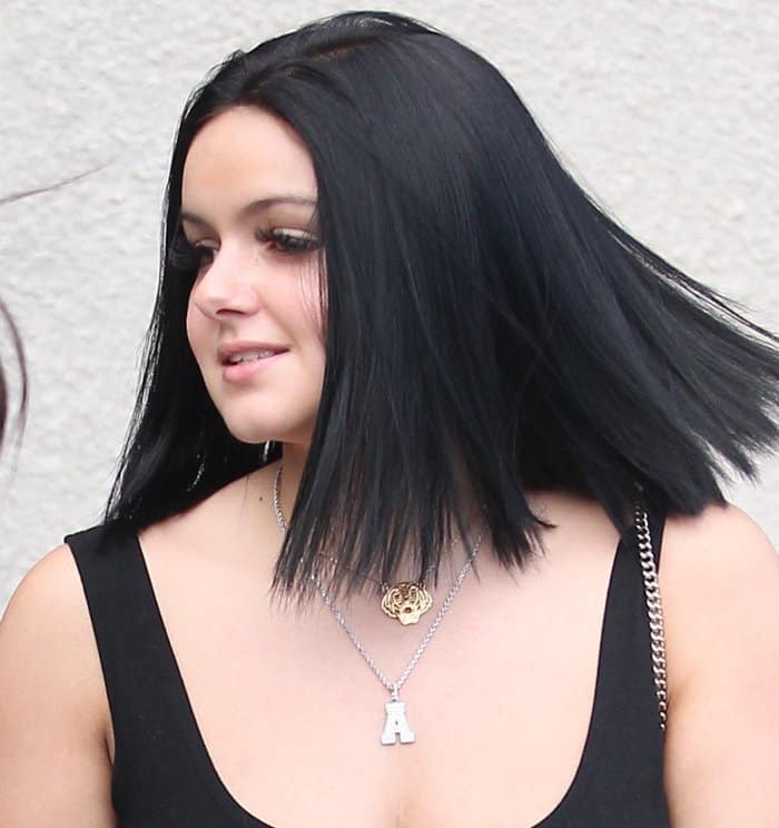 Ariel Winter adds a touch of personality to her look with layered necklaces featuring a bold initial "A" pendant and a unique tiger medallion