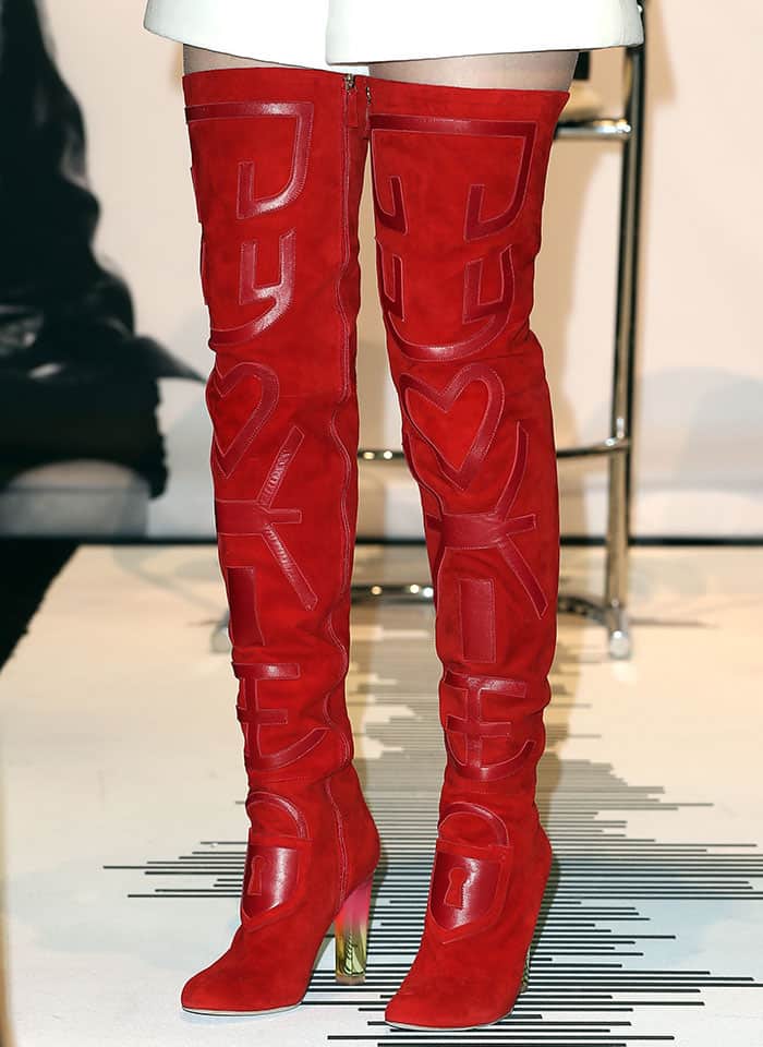 Celine Dion Steals Hearts in Schiaparelli and Red Suede Thigh-High Boots