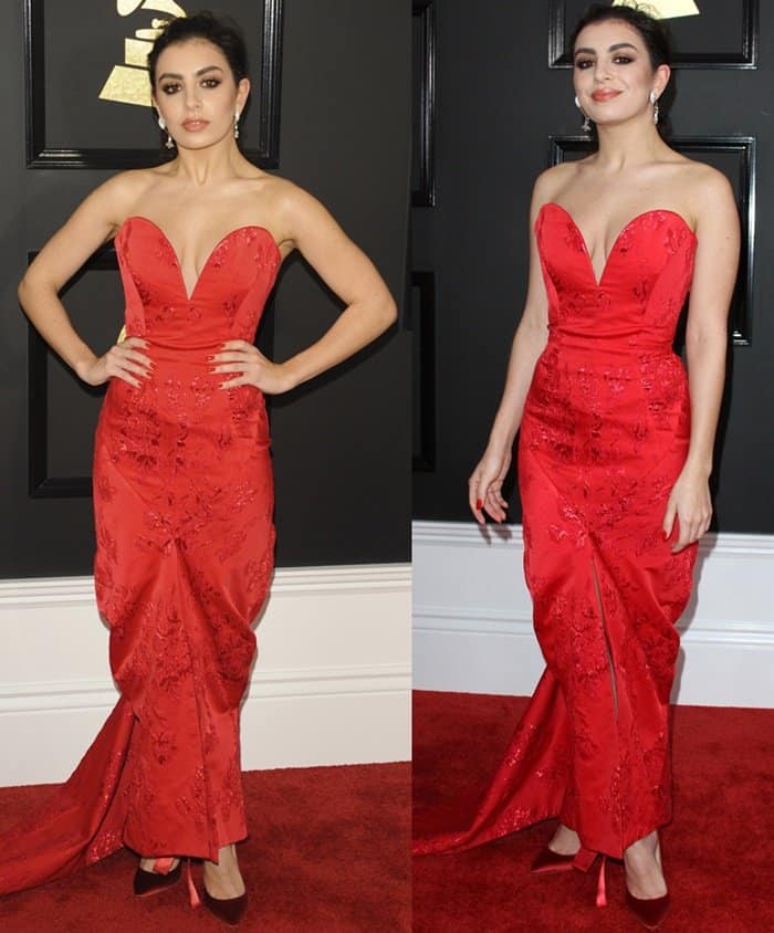 Charli XCX stuns in a Vivienne Westwood red gown with intricate embroidery and a plunging neckline at the 59th Annual GRAMMY Awards 2017 Arrivals held at the Staples Center in Los Angeles on February 12, 2017