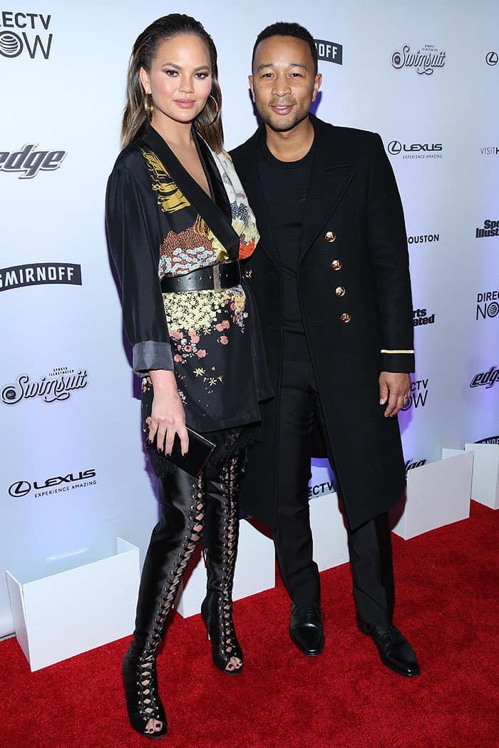 Chrissy Teigen posing with husband John Legend at the celebration of the 2017 Sports Illustrated Swimsuit Issue