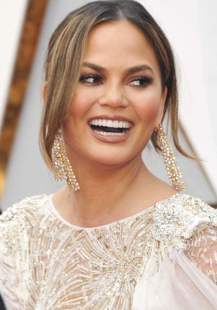 Chrissy Teigen shows off her jewelry from Lorraine Schwartz