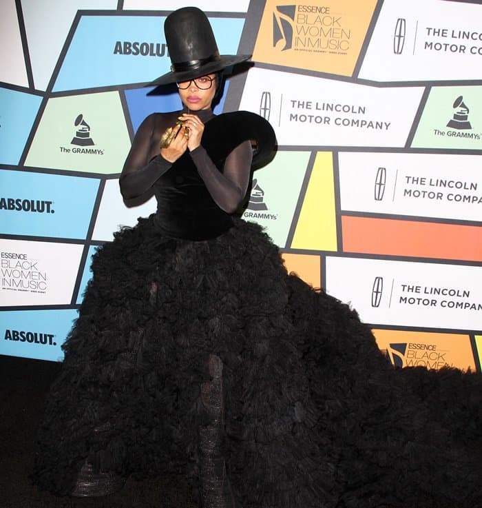 Erykah Badu slays the black carpet in a stunning black velvet one-shoulder gown from Ashi Studio's Fall 2016 Couture collection