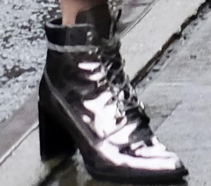 Gigi Hadid wears her namesake Stuart Weitzman "Gigi" boots in metallic leather